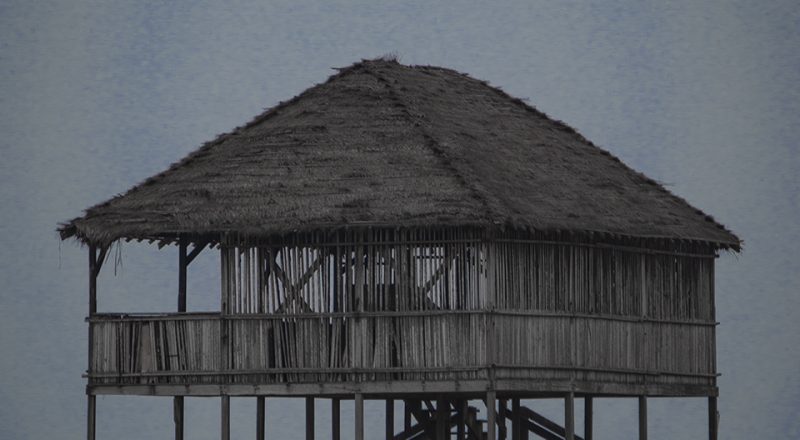 An Art Print of a wooden beach house